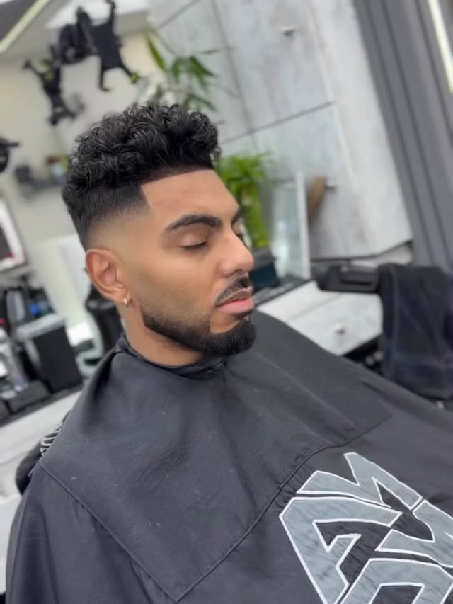High fade with curly top at Ampm Barbershop, Woodhaven Queens